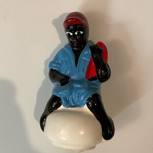 Black Americana Bell with boy on a chamber pot holding a watermelon Antique